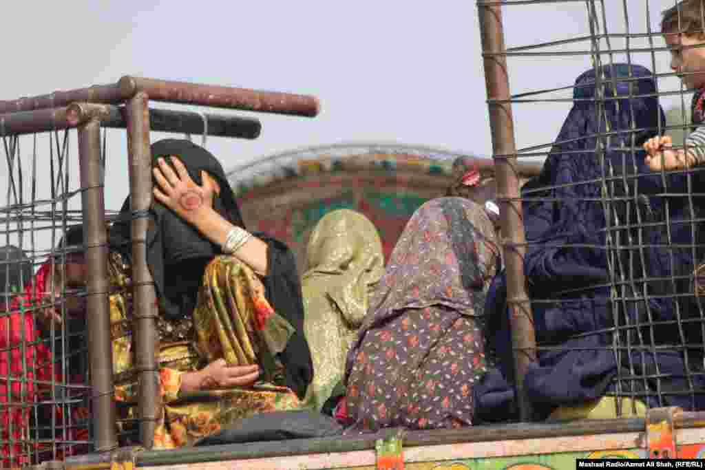 Afghans wait patiently for their journey to start at the Torkham border.