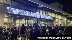 Local people gather for a pro-Palestinian rally at the Makhachkala airport ahead of the arrival of a scheduled flight from Tel Aviv on October 29.