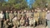 Sergei Aksyonov (center, back row), the Russian-installed head of Ukraine's Crimea region, visits Russian forces on the front line in mainland Ukraine in November.