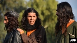 Members of the Islamic State-Khorasan (IS-K) group gather following their surrender to the now defunct Afghan government in November 2019.