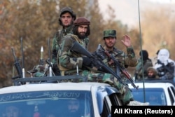 Taliban fighters patrolling the streets of Kabul after taking over the city.