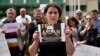 Leyla Mustafayeva, wife of Azerbaijani journalist Afqan Muxtarli, leads a June 1 protest in Tbilisi against her husband's reported forced return to Azerbaijan.