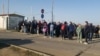 Russians wait to cross the border into west Kazakhstan on September 22, one day after the announcement of a 'partial mobilization' by President Vladimir Putin. 