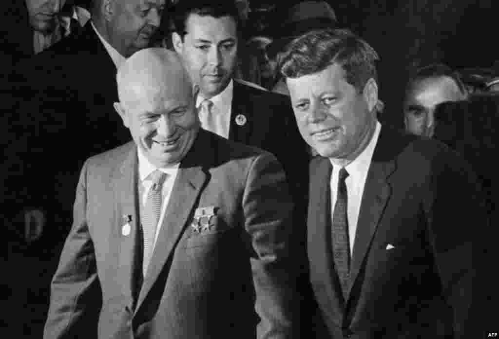 Between October 25 and 27, Soviet leader Nikita Khrushchev and U.S. President John F. Kennedy (left to right, seen here at East-West talks one year earlier) agree that Soviet missiles will be removed from Cuba if the United States publicly pledges never to invade Cuba.