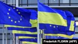 EU and Ukrainian flags flying near the European Parliament in Strasbourg. (file photo)