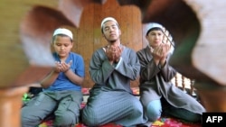 Kyrgyz boys during Friday Prayers in Bishkek (file photo)