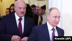 Russian President Vladimir Putin (right) and Belarusian President Alyaksandr Lukashenka attend a meeting of the Supreme Eurasian Economic Council in St. Petersburg in December 2019.