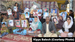 Families of Baluch victims of alleged enforced disappearances inside their protest camp in Quetta, Balochistan.