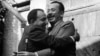 John Steinbeck (right) and Oleksandr Korneichuk, head of the Ukrainian Union of Writers, exchange hugs. Korneichuk was an informant, according to KGB documents.