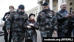 Protesters are detained at a demonstration in front of KGB headquarters in Minsk "to support arrested patriots" on March 31.