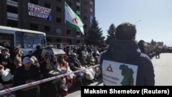 The number of protesters change as some go home to rest and then return to the site. At night there have been hundreds of people, but the crowd has swollen to thousands, including elderly men and women, in the daylight hours.