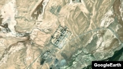 Next to an old Soviet outpost, is this a collection of strategically located buildings and lookout towers in Tajikistan controlled by Chinese troops part of Beijing's nascent but growing hard-power footprint in the region?