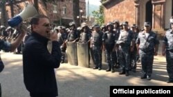 Armenian police chief Valeri Osipian addresses police forces in Ijevan on July 18. 