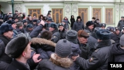 Demonstrators clash with police during a rally in Kazan on March 18 sparked by the death of Sergei Nazarov while in police custody.