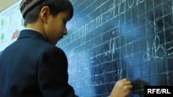 A student does exercises at a Turkmen-Russian bilingual school in Ashgabat.