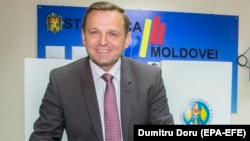 Chisinau Mayor-elect Andrei Nastase casts his ballot at a polling station.