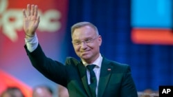 Polish President Andrzej Duda waves at the CPAC 2025 event in Washington on February 22.