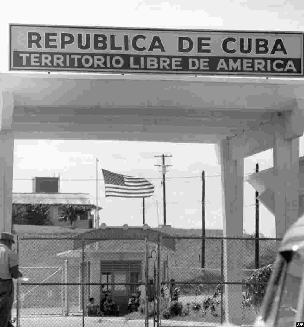 A sign above the entrance to the U.S. naval base in Guantanamo Bay, Cuba in February 1962, six months before the crisis, reads: Republic of Cuba -- American free territory