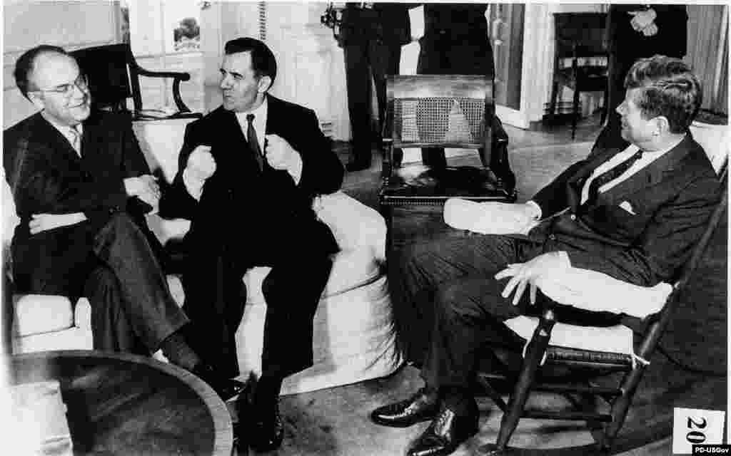 U.S. President John F. Kennedy (right) meets for two hours with Soviet Foreign Minister Andrei Gromyko (center) and Soviet Ambassador Anatoly Dobrynin in Washington on October 18. The Soviets say aid to Havana is intended to boost the &quot;defensive capabilities of Cuba.&quot;