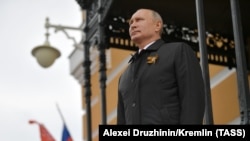 Russian President Vladimir Putin observing a military flyby in Moscow on May 9.