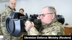 Prayers And Weapons: Ukraine Prepares As World Holds Breath