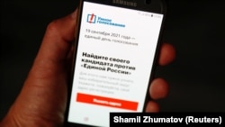 Aleksei Navalny's Smart Voting app is seen on a phone in Moscow on September 16.