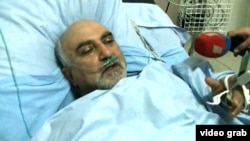 Candidate Paruyr Hairikian lies in a Yerevan hospital on February 1 after he was shot and wounded.