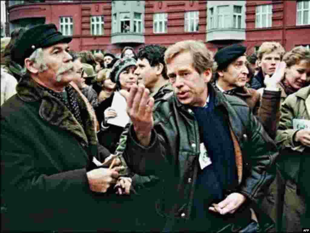 Havel (right) addresses a crowd of demonstrators celebrating the 40th anniversary of the Universal Declarations of Human Rights in Prague on December 10, 1988.