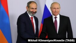 Armenian Prime Minister Nikol Pashinian (left) meets with Russian President Vladimir Putin in Sochi in May.