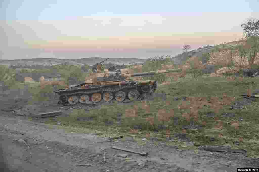 A destroyed tank in Jabrayil, after the town was captured by Azerbaijani forces, photographed from a passing car on October 16. &nbsp;