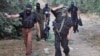 Palestinian Popular Resistance Committees (PRC) fighters return from positions on the border between the Gaza Strip and Israel in 2008.