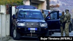 Police in front of former guerrilla leader and ex-speaker of Kosovo's parliament Jakup Krasniqi's house in Pristina on November 4. 