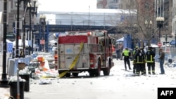 Firefighters take position after two explosions occurred near the finish line of the 117th Boston Marathon on April 15. 