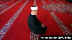 The head of Bosnia's Muslim Community, Grand Mufti Husein Kavazovic, prays alone in the Gazi Husrev Bay Mosque in Sarajevo on April 24.