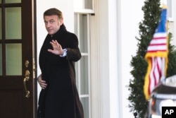 French President Emmanuel Macron arrives at the White House on February 24.