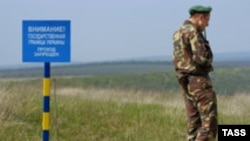 A Ukrainian border guard near one of 150 posts set up by Ukraine along its border with Moldova's breakaway region of Transdniester