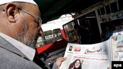 A man looks at the preliminary election results in Baghdad.