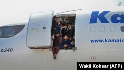 Desperate Afghans cram into a plane at the airport in Kabul in a bid to flee the country on August 16. (file photo)