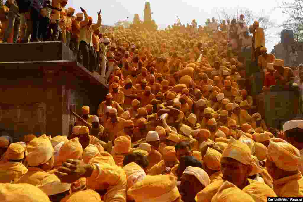 Hindus colored with turmeric powder during a festival at a temple in Jejuri, India, on February 4, 2019.