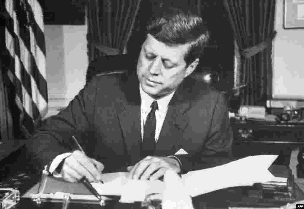 With U.S. military forces at alert posture DEFCON 2 for the only time in U.S. history, President Kennedy signs an order on October 24 for a naval blockade of Cuba.