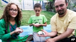 A family photo shows Ryan Corbett with his daughter and son in Kabul. Corbett was detained by the Taliban in 2022.