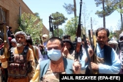 Another June 23 photo, this one taken in the Guzara region of the western Herat Province, shows Afghans who have vowed to fight alongside the country’s security forces against the Taliban.