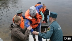 Children being rescued by emergency workers at the summer camp in Karelia.