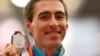 Sergei Shubenkov poses on the podium with the silver medal he won in the 110-meter hurdles event at the 2017 IAAF World Championships in London, where he competed as a neutral athlete. 